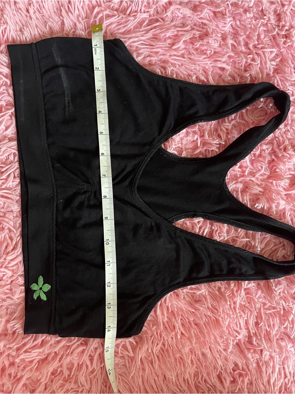 Seamless Black Racerback Sports Bra with Green Clover Accent